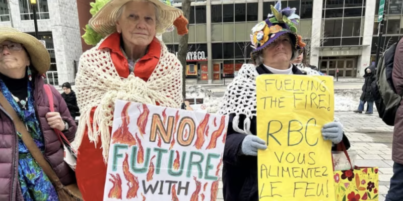 three older people with signs at a rally